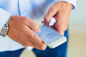 Man using smart phone, Texting