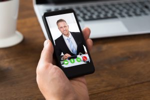 Close-up Of A Person Videochatting With Colleague On Mobile Phone