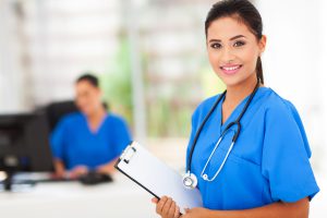 nurse holding a clipboard in clinic